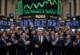 Wall Street stock exchange trading floor with digital ticker showing record highs